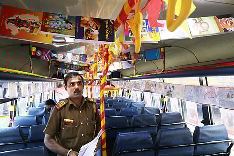 Bus Conductor Nataraj Kundur in his special 'Kannada Bus' at Shivamogga Depot ahead of Karnataka Rajyotsava. (Photo | Shimoga Nandan, EPS)