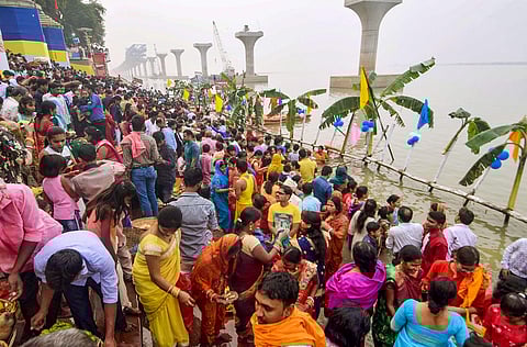 Devotees pray during Chhath Puja at the banks of River Ganga in Patna, Bihar. (Photo | PTI)