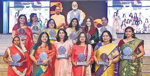 Devi Award winners with Uttar Pradesh Chief Minister Yogi Adityanath and The New Indian Express Editorial Director Prabhu Chawla at CMS Auditorium in Lucknow. (Photo | EPS)