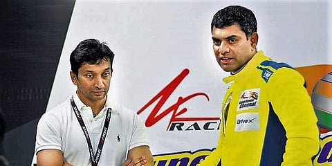 Veteran F1 driver Narain Karthikeyan (L) with teammate Arjun Bala ahead of the JK Tyre Festival of Speed in New Delhi, on Friday.