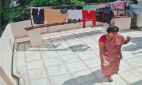 A screen grab of a CCTV from Hyderabad shows a woman on a terrace unaware that the private feed is available for everyone to watch on insecam.com