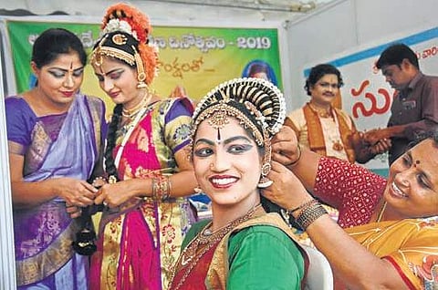 Artistes preparing for their performance as part of AP Formation Day celebrations at IGMC Stadium in Vijayawada on Sunday. (Photo | EPS/P Ravindra Babu)