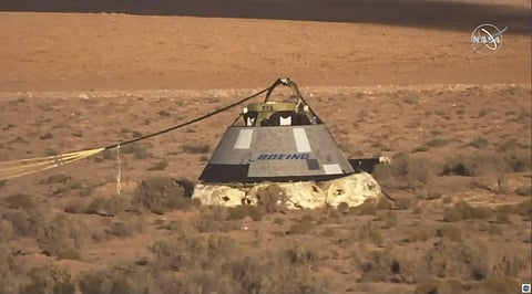 In this image made from a video provided by NASA the Starliner capsule rests on the ground after a test of Boeing's crew capsule's launch abort system in White Sands Missile Range in N.M., on Monday, Nov. 4, 2019. | (Photo | AP)