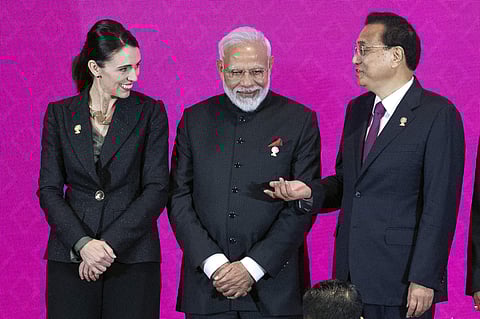 From left, New Zealand Prime Minister Jacinda Ardern, Indian Prime Minister Narendra Modi, Chinese Premier Li Keqiang talk before a group photo at The Regional Comprehensive Economic Partnership Association of Southeast Asian Nations (ASEAN) summit in Non