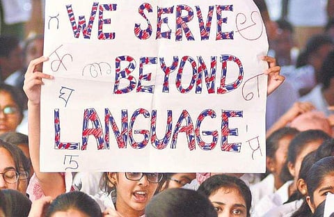 Doctors from Minto Hospital protest against the alleged assault on their colleague by members of the Karnataka Rakshana Vedike, on Monday I Shriram BN
