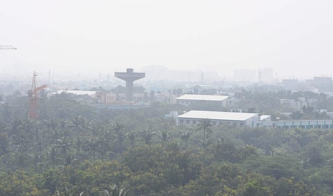 Thick blanket of smog engulfed Chennai as air quality remained poor under unfavorable weather conditions. | (Photo | R Satish Babu/EPS)