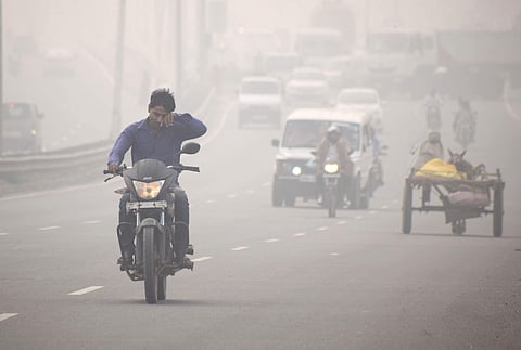 A motorcyclist rides through thick smog on NH-2 in Mathura Sunday Nov. 03 2019. | (Photo | PTI)