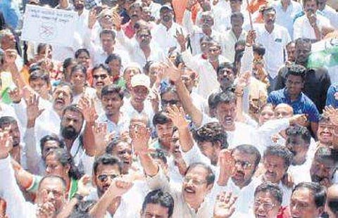Congress workers stage a protest at Trinity Circle, Bengaluru, on Tuesday 