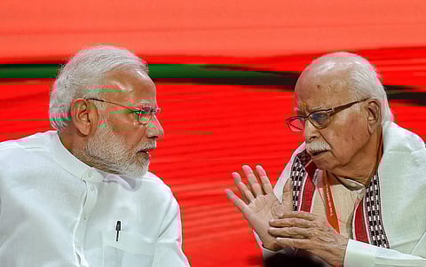 A file photo of Prime Minister Narendra Modi and BJP senior leader LK Advani during BJP National Executive Meeting, in New Delhi. (Photo | PTI)