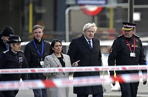 Britain's Prime Minister Boris Johnson with officials attend the scene in central London, Saturday, Nov. 30, 2019, after an attack on London Bridge on Friday. (Photo | AP)