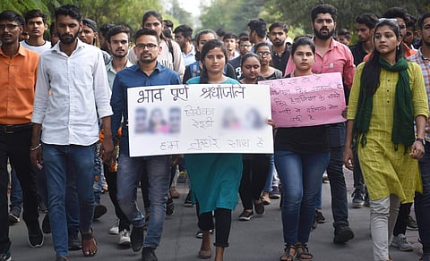 Hyderabad students participate in a rally to condemn the rape and murder of a veterinary doctor in the city. (Photo | PTI)