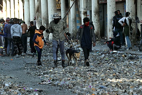 Anti-government protesters gather during clashes with security forces in Baghdad, Iraq. (Photo | AP)