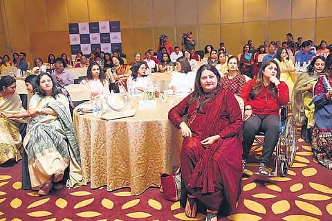 The delegates and attendees at The Park as actor-author Tara Deshpande in a red top and black trousers looks on| Express