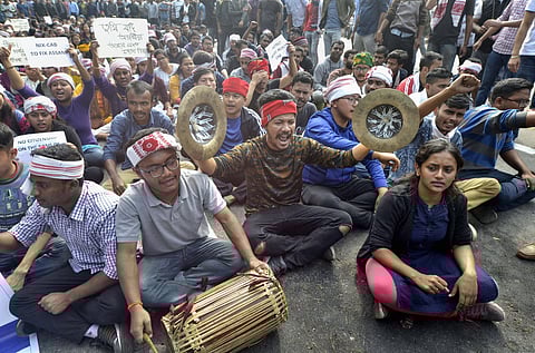 College students raise slogans in protest against the Citizenship Amendment Bill CAB during a strike in Guwahati Wednesday. (Photo | PTI)
