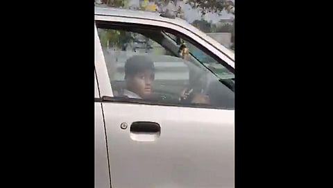 The screenshot of the boy driving the car (Photo| Twitter screengrab)