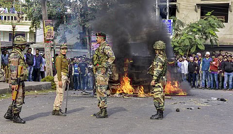 Army personnel attempt to control protestors during an agitation against the passing of Citizenship Amendment Bill in Tezpur. (Photo | PTI)