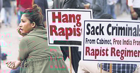 A woman at a protest demanding strong punishment for rapists at Rajiv Chowk in New Delhi.