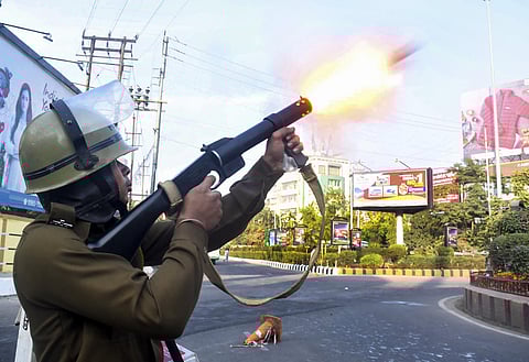 Police fire teargas shells to disperse protesters during their clashes as they march against the Citizenship Amendment Bill 2019 in Guwahati Thursday Dec. 12 2019. (Photo | PTI)