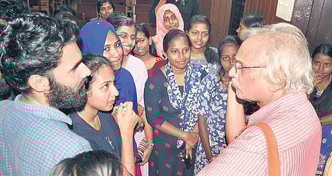 Writer M Mukundan interacts with students, following a talk organised by the Malayalam Department of Maharaja’s College in Ernakulam on Thursday | A SANESH