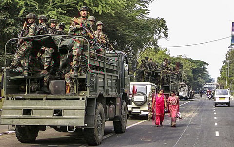 Army personnel conduct a flag march amid protests across the city against the passing of Citizenship Amendment Bill in Guwahati. (