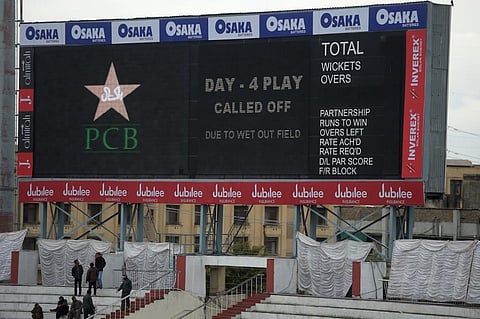 A score board announces that play was called off following overnight rain on the fourth day of the first Test cricket match between Pakistan and Sri Lanka at the Rawalpindi Cricket Stadium. (Photo | AFP