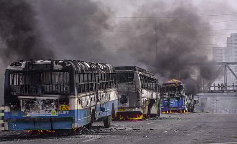 Vehicles torched by protestors agitating against the passing of Citizenship Amendment Bill CAB at Sanmtragachi in Howrah district of West Bengal Saturday Dec. 14 2019. (Photo | PTI)