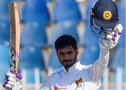 Sri Lanka's Dhananjaya de Silva celebrates after scoring a century (100 runs) during the first Test match between Pakistan and Sri Lanka in Rawalpindi (Photo| AFP)