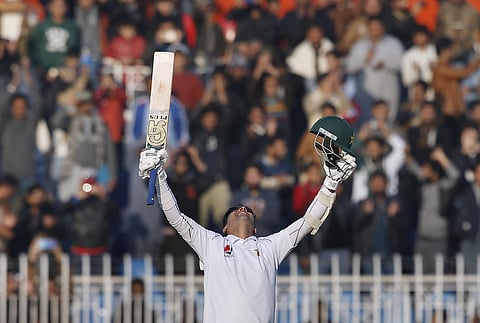 Pakistani batman Abid Ali celebrates after completing his century during the fifth-day of the 1st cricket test match between Pakistan and Sri Lanka, in Rawalpindi, Pakistan, Sunday, Dec. 15, 2019. (Photo |AP)