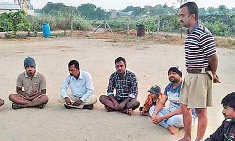 Pranab Bala, RSS leader, holding a shakha at a Bangladesh camp in Raichur district