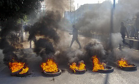 Demonstrators burn tyres during a strike called by All Assam Students Union. (Photo| PTI)