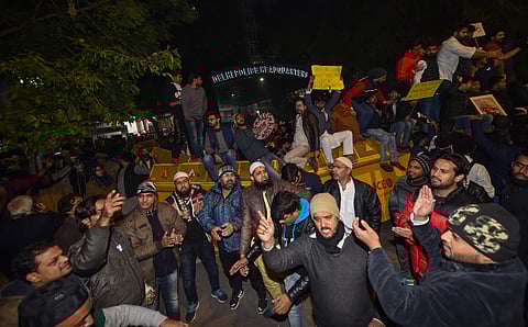 Students and other protest against the police action against students of the Jamia Millia Islamia University. at PHQ in New Delhi Sunday night Dec. 15 2019. (Photo | PTI)