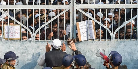 Lucknow Police force outside Darul Uloom Nadwatul Ulama college as students protest against the amended Citizenship Act and indulged in stone pelting. (Photo | PTI)