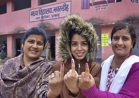 A first-time voter and her relatives show their inked finger after casting votes during the fourth phase of Jharkhand Assembly polls, in Dhanbad. (Photo | PTI)
