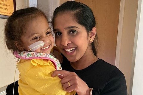 Kidndey donor Surinder Sapal with the child.