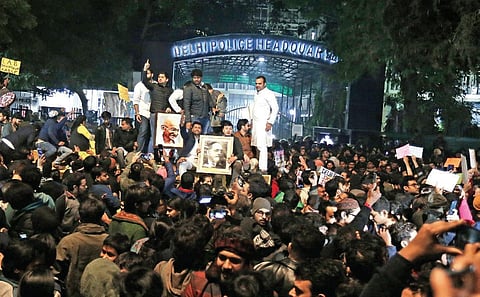 Students and others protest the police action against students of Jamia Millia Islamia. at PHQ on Sunday night. (Phoyo | Arun Kumar)