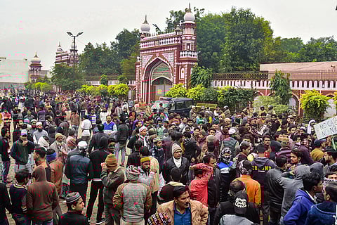 People gather at the Eidgah to protest against the alleged police action on AMU students who were protesting over Citizenship Amendment Act in Aligarh Monday. (Photo | PTI)
