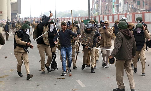 Police personnel detain an alleged protestor during a demonstration demanding withdrawal of Citizenship Amendment Act at Seelampur in New Delhi Tuesday Dec. 17 2019. (Photo | Shekhar Yadav/EPS)