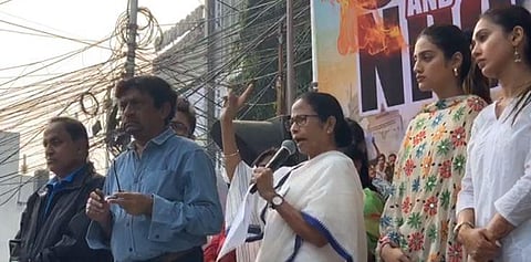 West Bengal CM and Trinamool Congress supremo Mamata Banerjee accompanied by party MPs Nusrat Jahan and Mimi Chakraborty, addresses during her party's '#NoCABNoNRC' protest march from Jadavpur to Bhowanipore (File Photo| IANS)