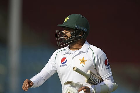 Pakistani captain Azhar Ali walks on his way to pavilion after being bowled by Sri Lankan Vishwa Fernando. (Photo | AP)