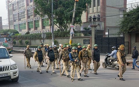 Police personnel patrol a street a day after protestors resorted to stone-pelting and clashes during an agitation against the Citizenship Amendment Act in Delhi. (Photo | PTI)