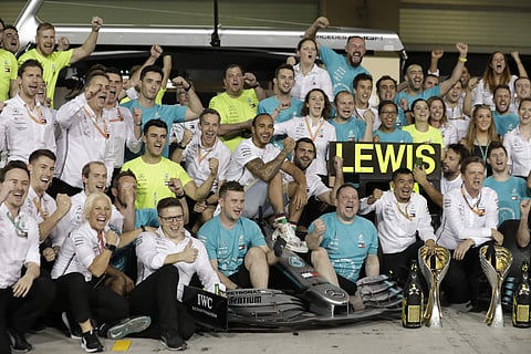 Mercedes driver Lewis Hamilton of Britain, center, poses for photograph with team members celebrating after the Emirates Formula One Grand Prix at the Yas Marina racetrack in Abu Dhabi, United Arab Emirates, Sunday, Dec.1, 2019. (Photo | AP)