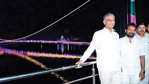 State Finance Minister T Harish Rao and Tourism Minister Srinivas Goud after the inauguration of the suspension bridge in Siddipet on Sunday.