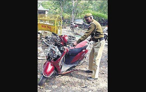 The damaged scooty the three victims were riding. ( Photo | EPS, Parveen Negi)