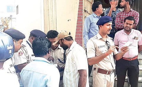 Police imposing fine on traffic regulation violators at Madhupatna Square in Cuttack on Sunday| Express