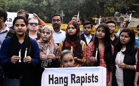Youngsters during a candle light march held in solidarity of veterinary docto at Jantar Mantar in New Delhi on Sunday. (Photo | Shekhar Yadav, EPS)