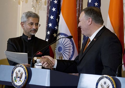 US Secretary of State Mike Pompeo (R) shakes hands with External Affairs Minister Dr S Jaishankar after a bilateral meeting the US and India at the Department of State in Washington (Photo| AP)