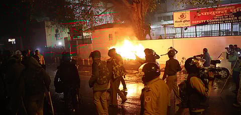 A car burns after being set on fire during demonstrations against India's new citizenship law in New Delhi on Friday. (Photo | Shekhar Yadav, EPS)