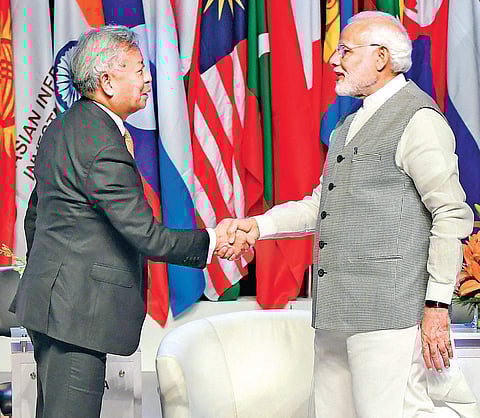 Prime Minister Narendra Modi greets Asian Infrastructure Investment Bank chief Jin Liqun at the third annual meeting of AIIB Forum in Mumbai on Tuesday. (Photo | PTI)