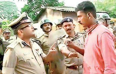 Mangaluru Police Commissioner Dr P S Harsha stops a journalist from Kerala, who was covering the protest | express