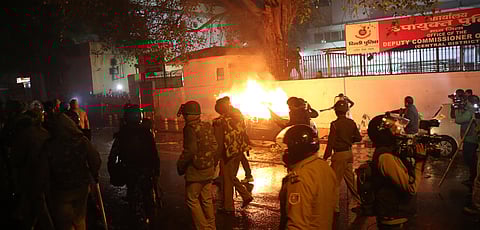 A car burns after being set on fire during demonstrations against Citizenship Act at Dariyaganj in New Delhi on Friday. (Photo | Shekhar Yadav/EPS)